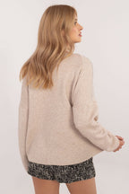 Långarmad tröja med glimmande stenar beige